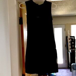Black Armani Exchange mid length dress with lace back , half flap open.